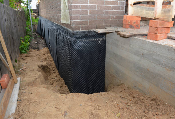 SJ Waterproofing Pros technician performing targeted Exterior Waterproofing assessment in Savage, MD